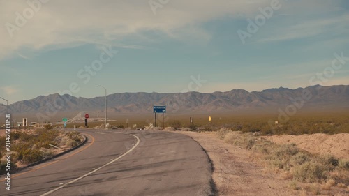 Person walking on a lonely desert road in the american southwest