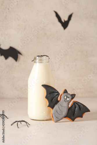 Bottle of milk, bats and ta...