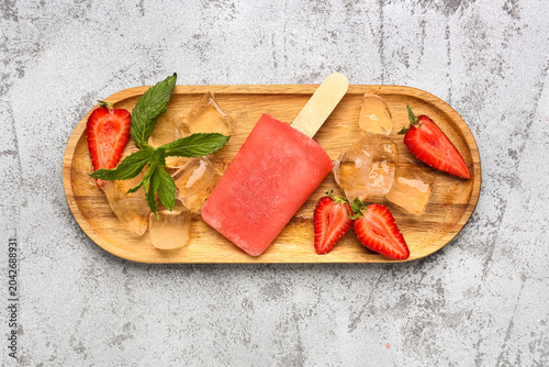 Wooden board with strawberr...