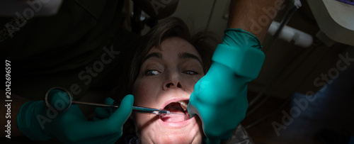 Obraz na płótnie Patient receiving a local anesthetic injection prior to root canal treatment in a dental clinic