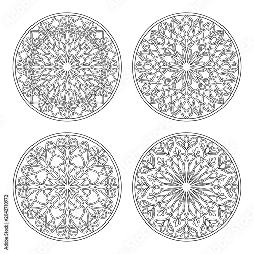 Four intricate circular mandala patterns for creative coloring activities