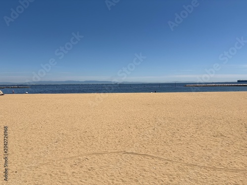 Sandy Beach and Blue Sea on a Sunny Day