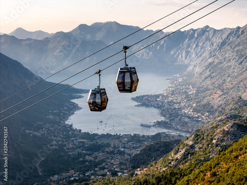 Cable Cars Move Over Mountains and a Bay of Kotor, drone shot