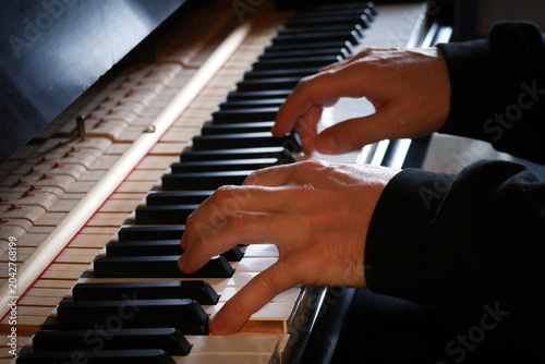 Pianist hands detail during a piano practice