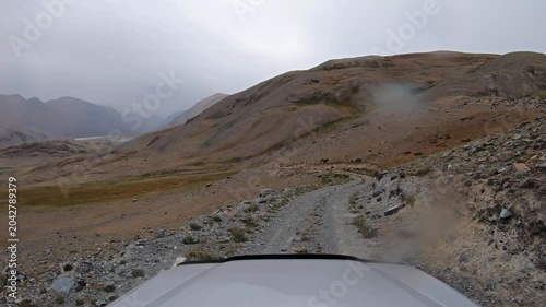 Descent from the mountain pass into the valley of the Akkul and Karakul lakes and the Akkol River in Altai.