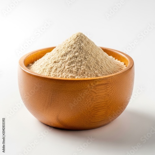 Wooden bowl filled with light brown powder