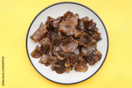 Edible jelly ear mushrooms. Fresh wood ear mushrooms on a plate, ingredient for Asian cuisine