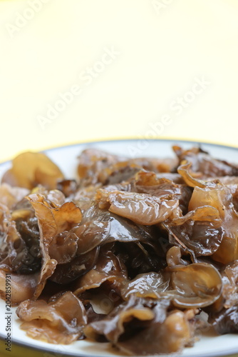Edible jelly ear mushrooms. Fresh wood ear mushrooms on a plate, ingredient for Asian cuisine