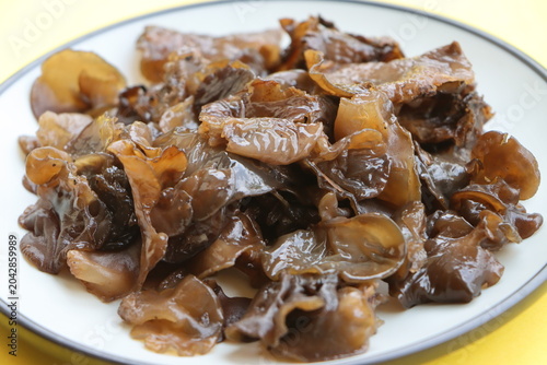Edible jelly ear mushrooms. Fresh wood ear mushrooms on a plate, ingredient for Asian cuisine