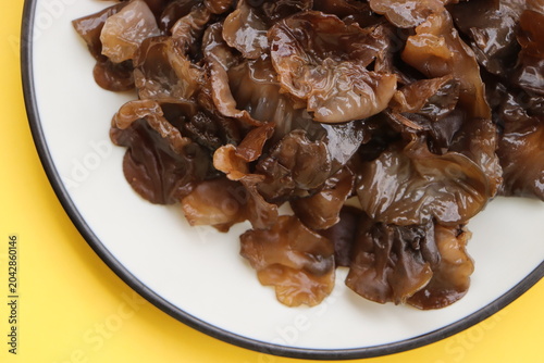 Edible jelly ear mushrooms. Fresh wood ear mushrooms on a plate, ingredient for Asian cuisine