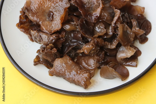 Edible jelly ear mushrooms. Fresh wood ear mushrooms on a plate, ingredient for Asian cuisine