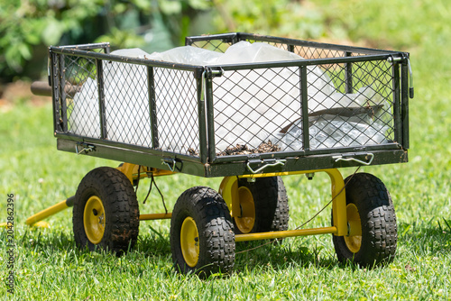 Принти на полотні a workhorse garden cart with metal cage sides and pneumatic wheels is elevated a