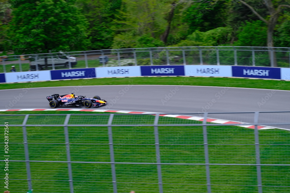 Obraz premium May 24, 2025, Montreal, Canada: Red Bull Racing Formula 1 car during by Hadjar or Verstappen, demonstration run at Circuit Gilles Villeneuve. g.