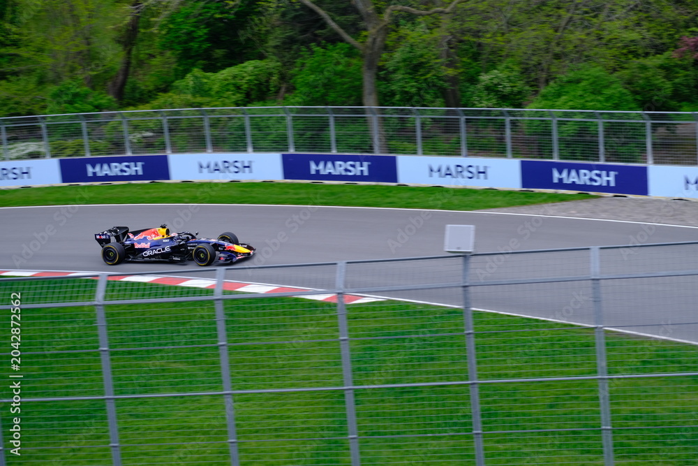 Naklejka premium May 24, 2025, Montreal, Canada: Red Bull Racing Formula 1 car during by Hadjar or Verstappen, demonstration run at Circuit Gilles Villeneuve. g.