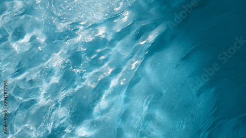 Clear water blue water water surface ripple wave abstract texture Top flat view of close up clear water, blue ripple and wave water surface
