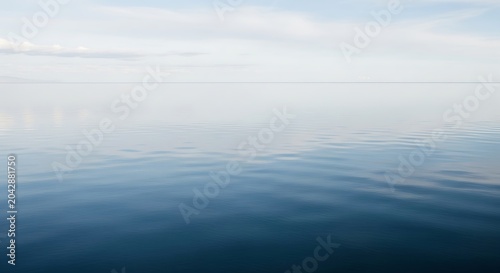 Calm blue lake landscape with pastel sky