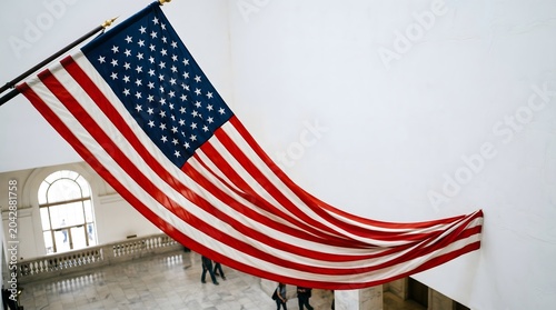 Waving American flag with stars and stripes in the wind against the sky symbol of freedom and patriotism