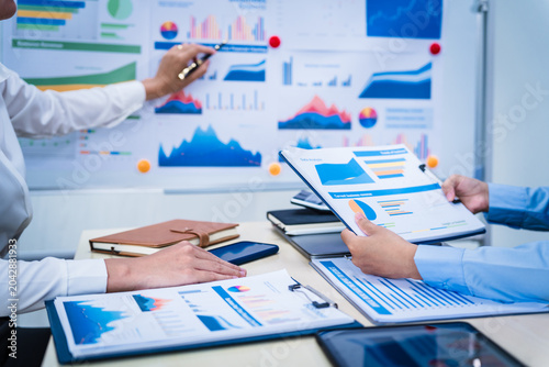 Canvas Print Experienced Asian woman trains new employee in office work, teaching secretarial duties, document management, assistant manager responsibilities