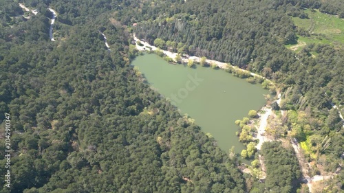 Aerial View of Karagol Lake Surrounded by Dense Green Pine Forest in Izmir Turkey. High quality 4k footage