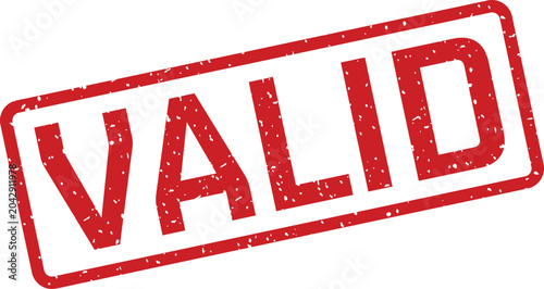 фотографія Red rubber stamp with the word 'valid' isolated on white background