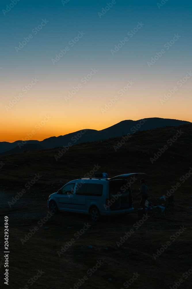 Naklejka premium Grand panoramic view from Prutas peak at night with sky, overlooking the dramatic limestone ridges and deep valleys of Durmitor National Park, Montenegro.