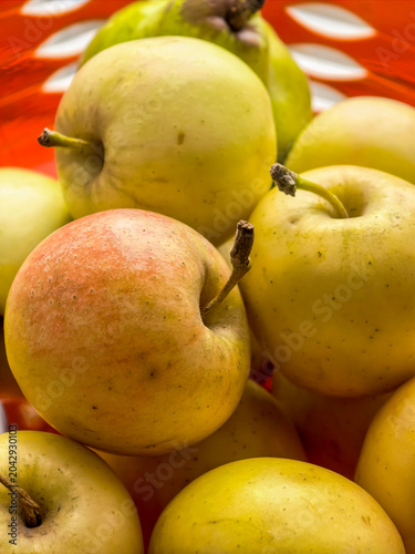 Fresh Yellow Apples In Red Basket Close Up