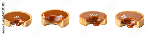 Set of bitten salted caramel tarts isolated on black background
