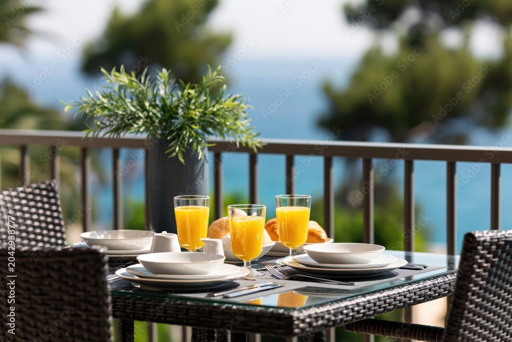 Fototapeta premium Breakfast on balcony with ocean view morning vacation travel resort hotel sea