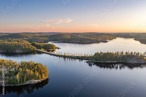 Aerial Sunset View of Saimaa Lake Archipelago and Pine Forests in Finland