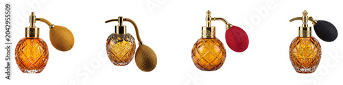 Vintage crystal perfume bottles with gold atomizers on black background
