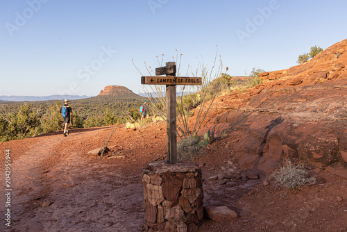 People hiking on the Canyon of Fools trail