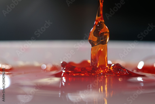Foto Cough syrup is an oral medication formulated to soothe throat irritation, suppre