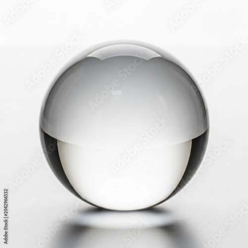 Transparent glass sphere ball isolated on a clean white background