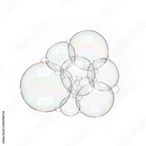 Transparent soap bubbles cluster with iridescent reflections isolated on a white background