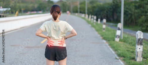Принти на полотні Adult female runner with back and waist ache due to piriformis syndrome and low back pain