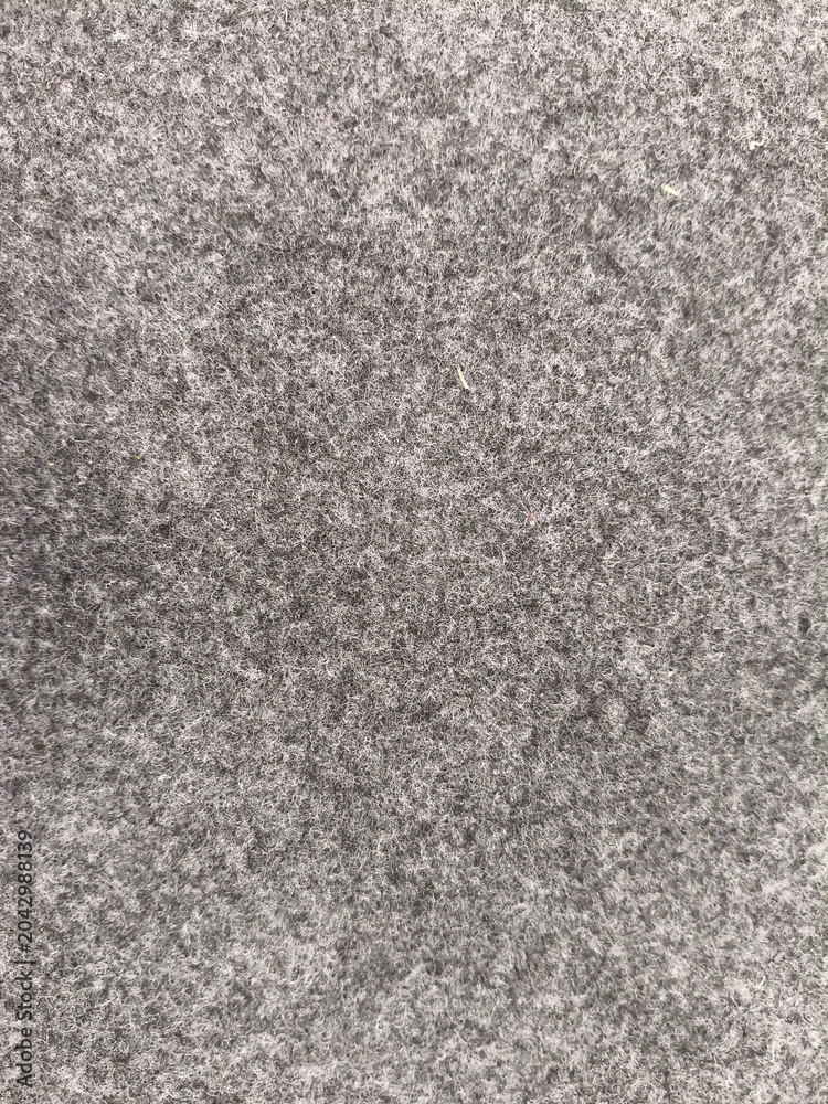Fototapeta premium a close-up photo of gray concrete texture patterned on plain wall on March, 2026.