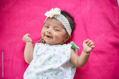 Canvas-taulu cute indian baby girl sleeping on pink background