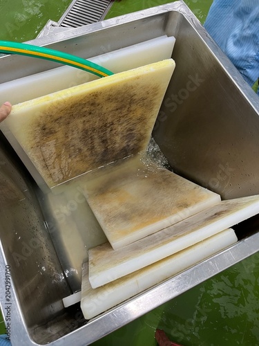 Food contact surface showing visible wear and heavy staining. Image related to sanitation inspection, food safety management, equipment hygiene, and preventive maintenance programs in food processing 
