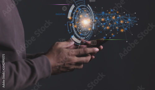 Young man hand uses smartphone touching technology circle, Digital Connectivity, World of communication via modern networks and online systems via the Internet
