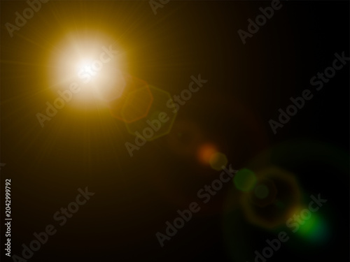 Foto Bright golden sun lens flare with polygonal bokeh ghosts isolated on black background