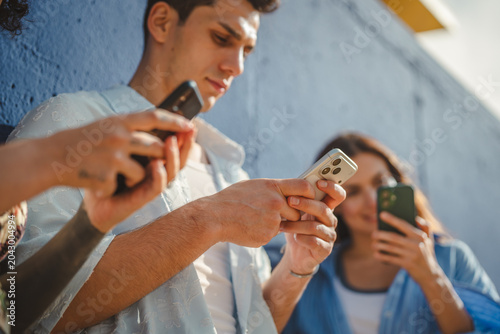 Fotografi Young people glued to smart phones connected to digital world