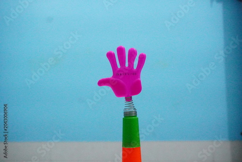 Quadro em tela Mini plastic hand clap toy candy combines playful spring-action clapping fun with sweet confectionery treats