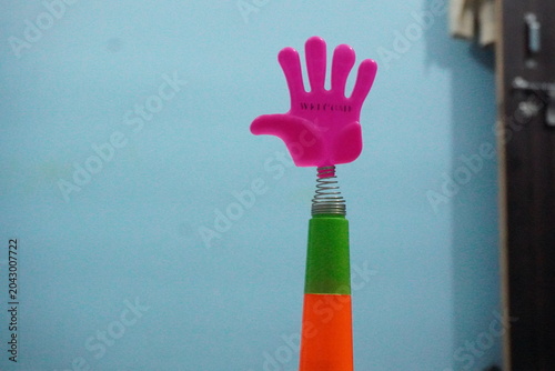 Fotografia Mini plastic hand clap toy candy combines playful spring-action clapping fun with sweet confectionery treats