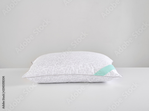 Single white pillow isolated on white background, minimal clean composition emphasizing softness, comfort, hygiene, and modern bedding product presentation with simple, elegant aesthetic style.