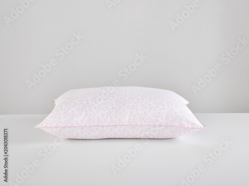 Single white pillow isolated on white background, minimal clean composition emphasizing softness, comfort, hygiene, and modern bedding product presentation with simple, elegant aesthetic style.
