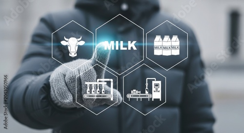 Person interacting with digital milk production icons on a touchscreen interface with futuristic graphics and cow, factory, and bottle illustrations