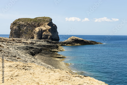 Fungus Rock and Limestone Coastline at Dwejra Bay, Gozo