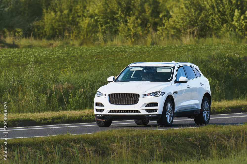 Fototapeta premium Elegant luxury SUV on comfortable road trip