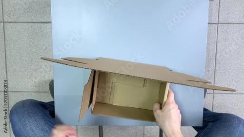 DIY box. Cardboard box. Table. Slow motion video. High quality 4k footage