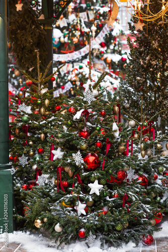 Beautiful Christmas background. Concept of decorations and decor for the new year 2027. Christmas trees on the streets of Moscow with festive decorations in the snow.